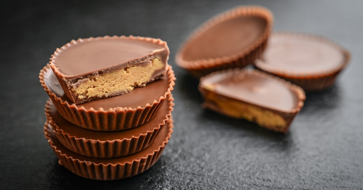 peanut butter cups on black background