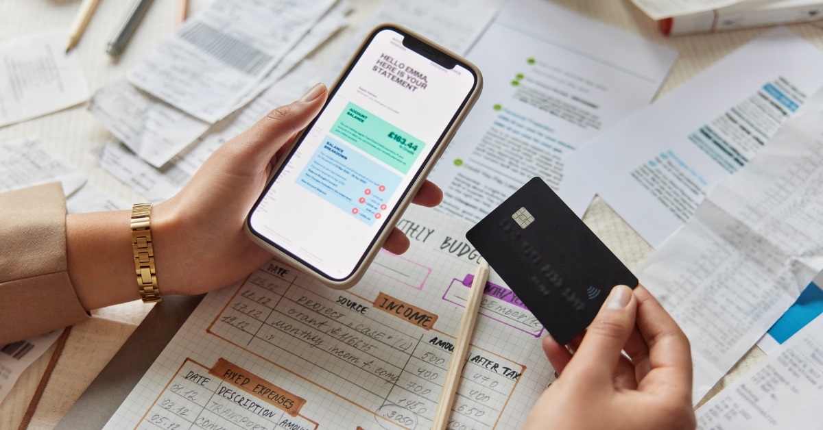 woman planning budget using smartphone