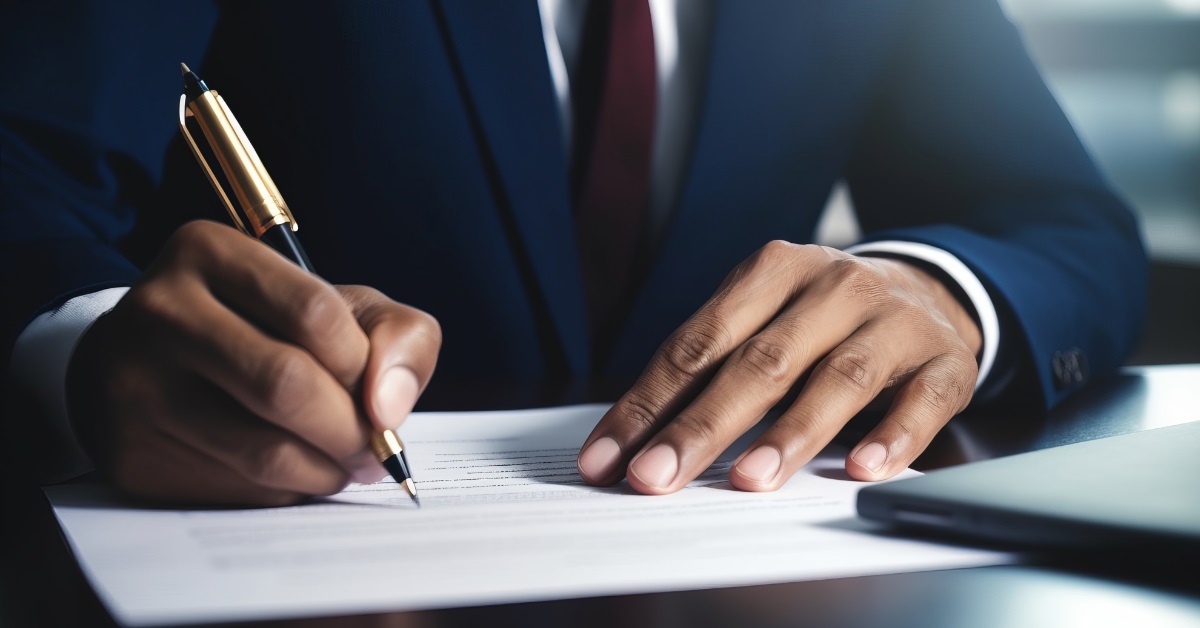 businessman signing contract at work