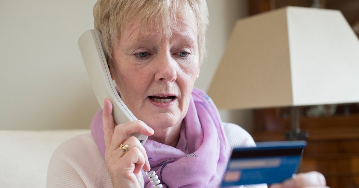 senior woman giving credit card