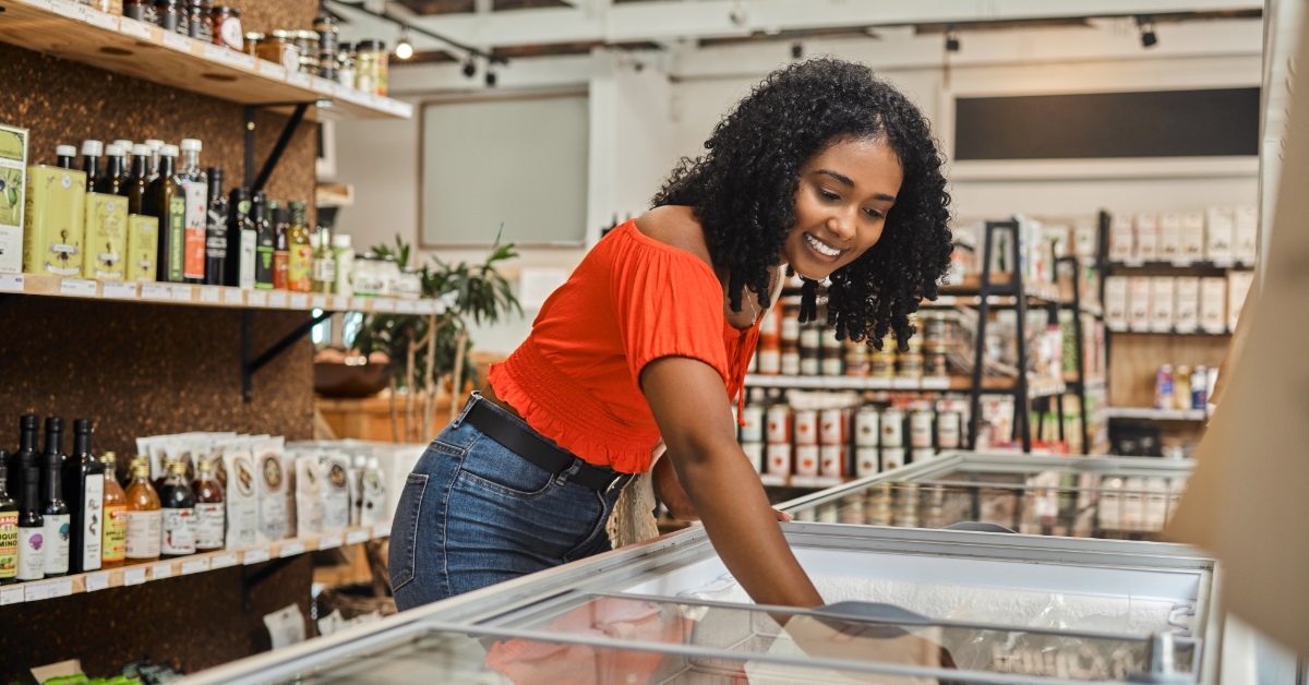 african american woman buying frozen items