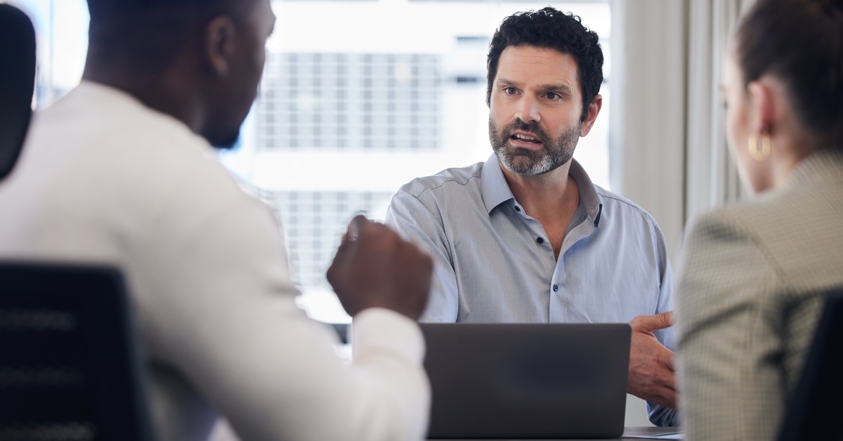 businessman arguing with colleagues at work