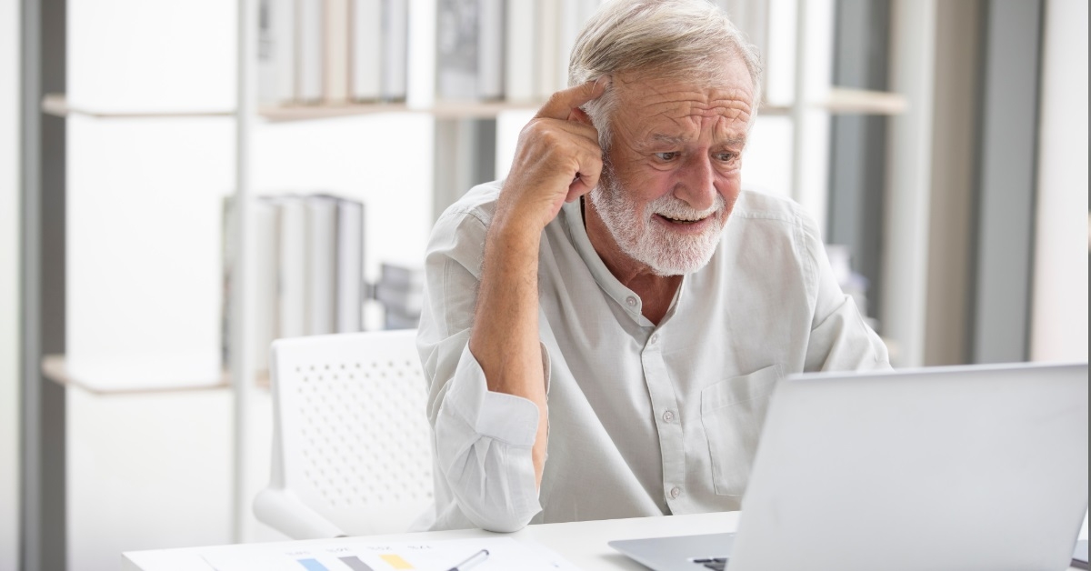 senior businessman using laptop for work