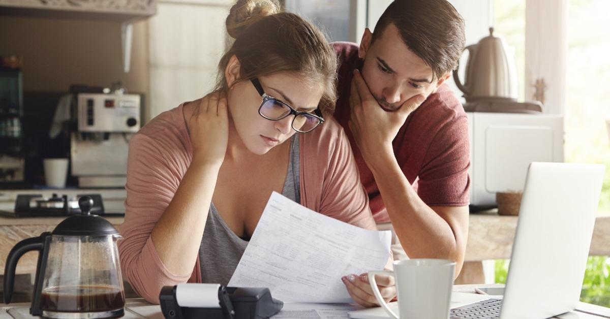 young couple reviewing bills together