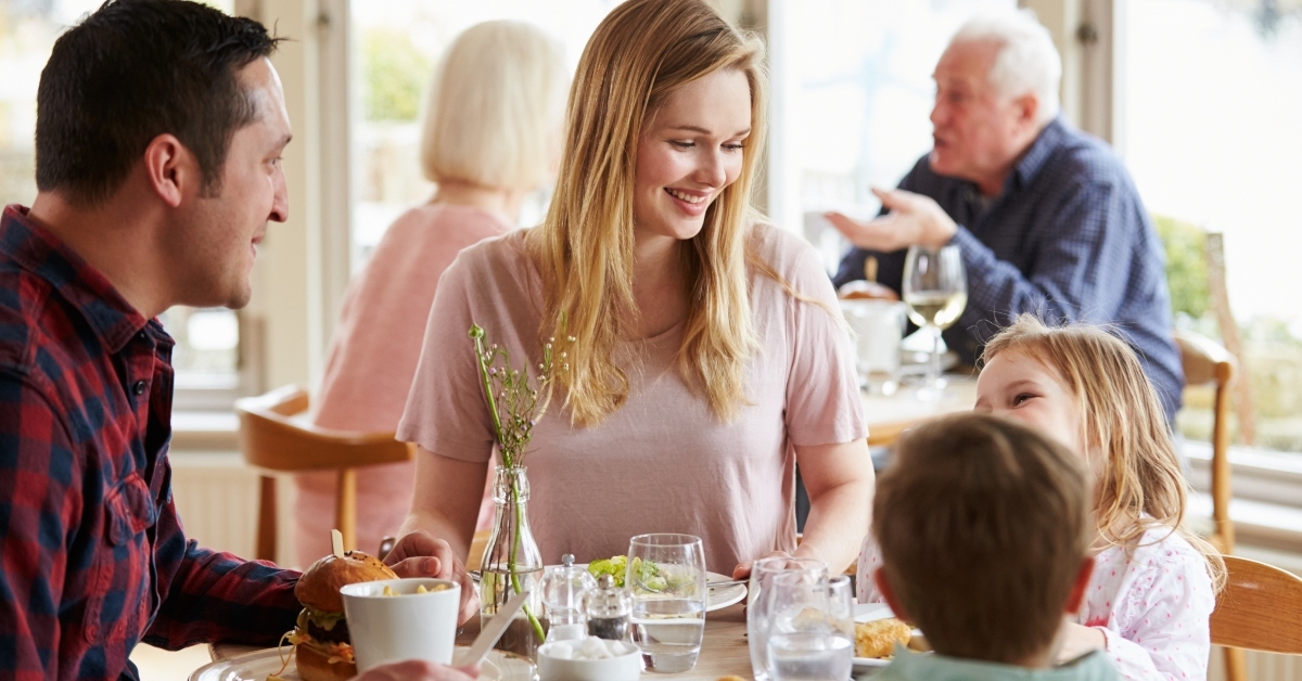 family enjoying meal in restaurant