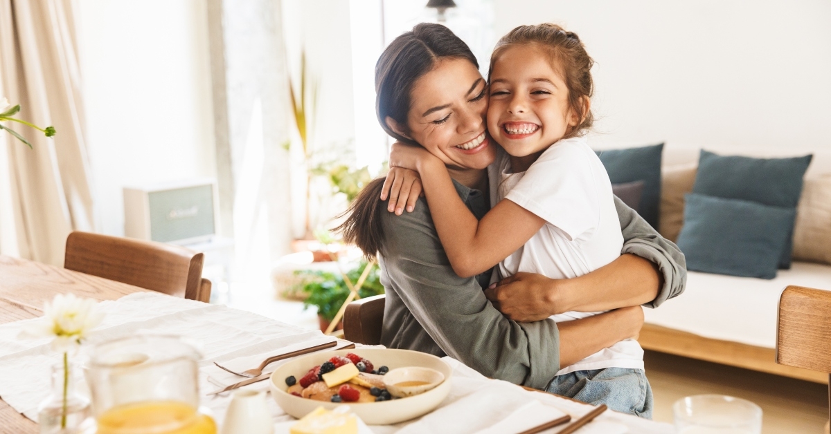 mother and little daughter hugging