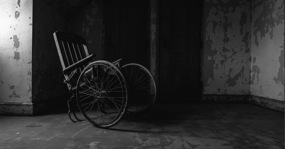 broken wheelchair in abandoned asylum
