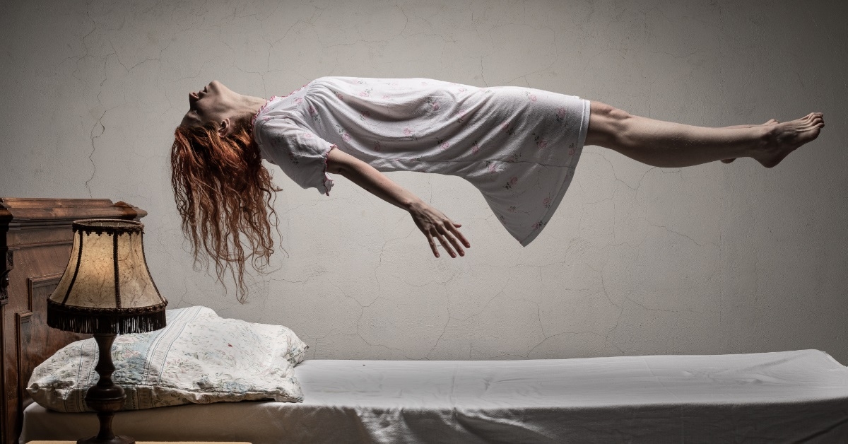 haunted woman levitating over bed