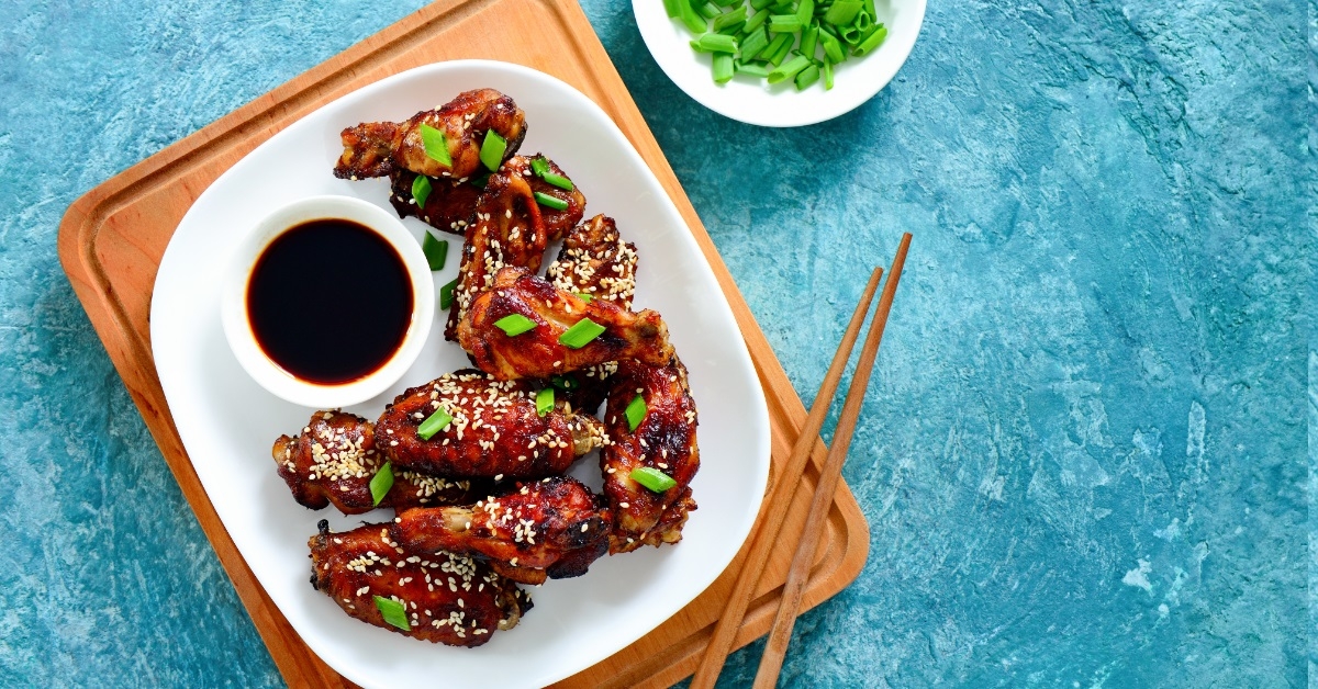 asian style chicken wings with chopsticks