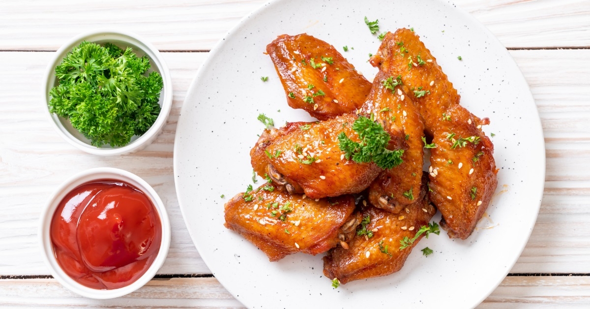 bbq chicken wings on white plate