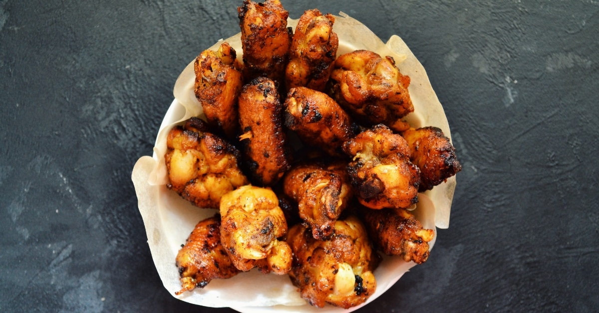 chicken wings plate on dark background