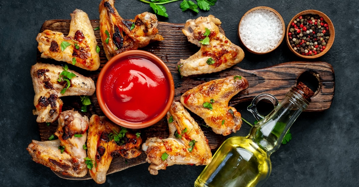 grilled chicken on wooden board