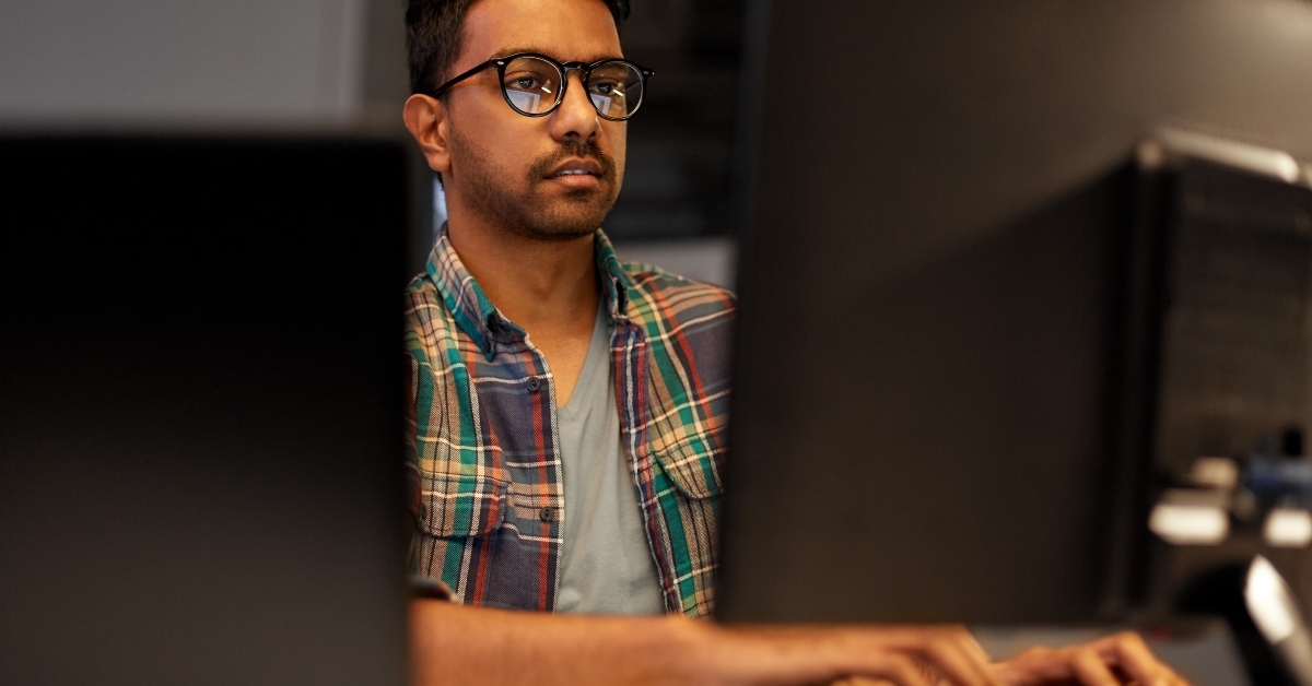 creative man in glasses working