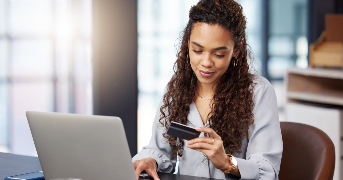woman using card for online shopping