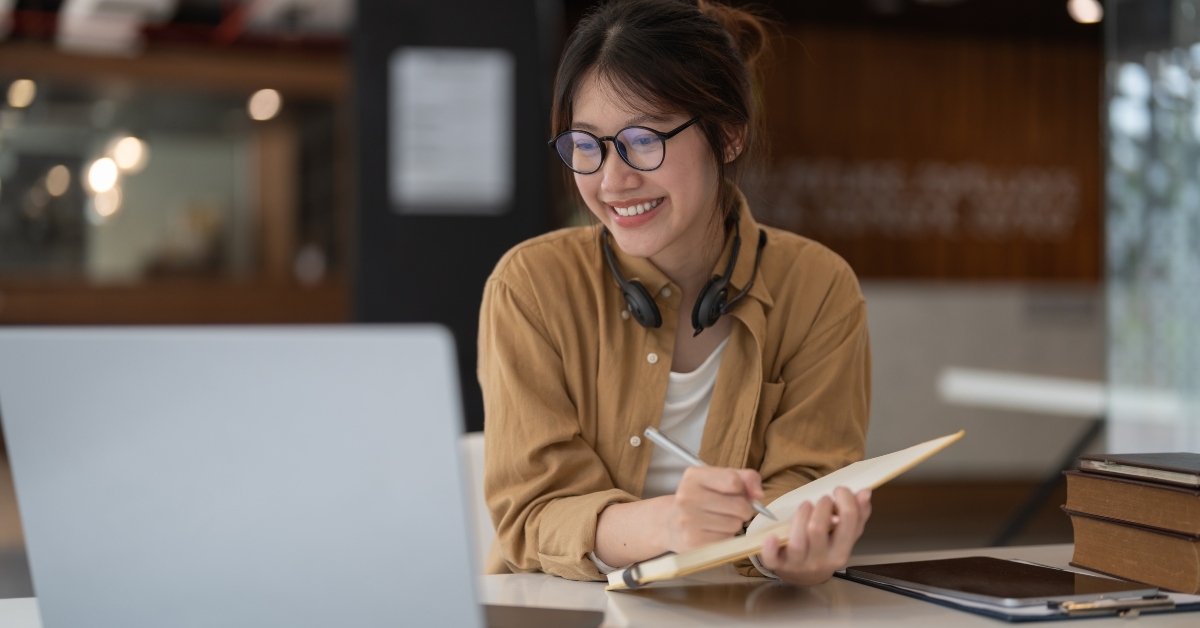 young asian woman using laptop