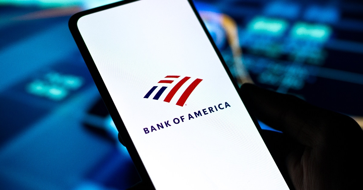 The phone screen displays the Bank of America logo.