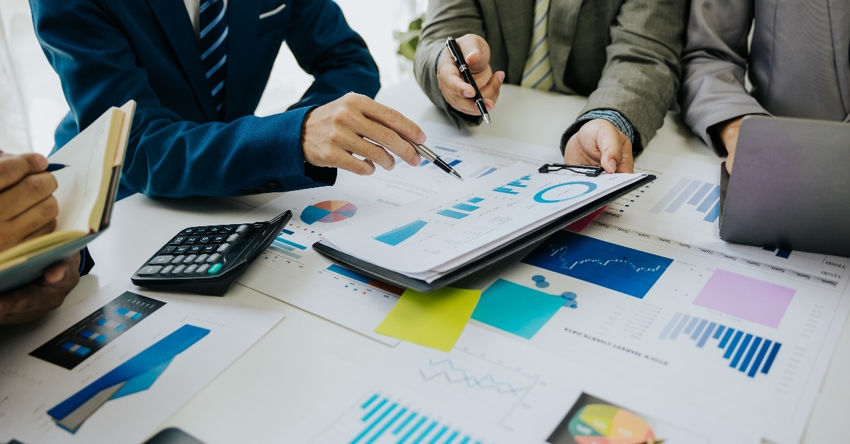 Businesspeople reviewing and interpreting data.