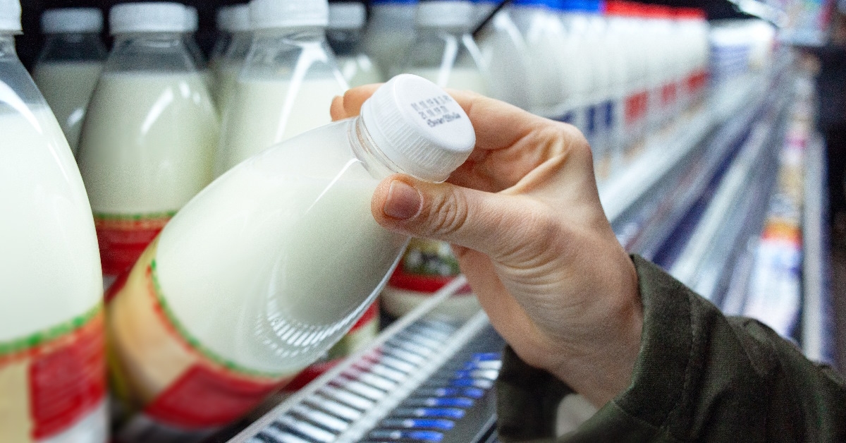 man checks product expiration date