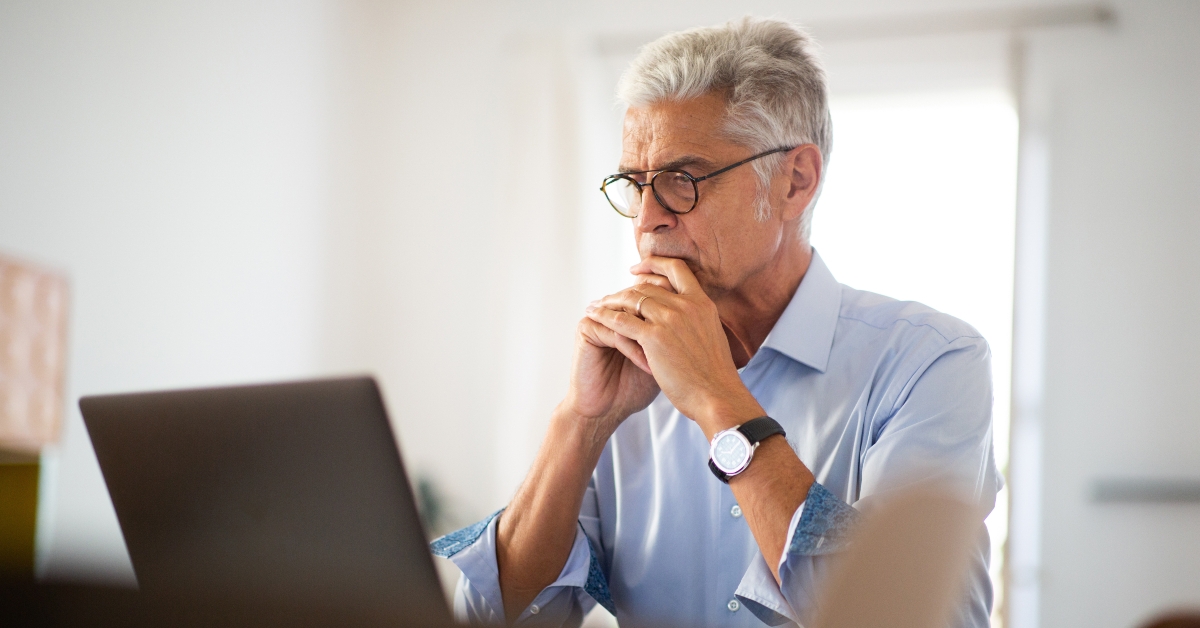 older businessman sitting in office