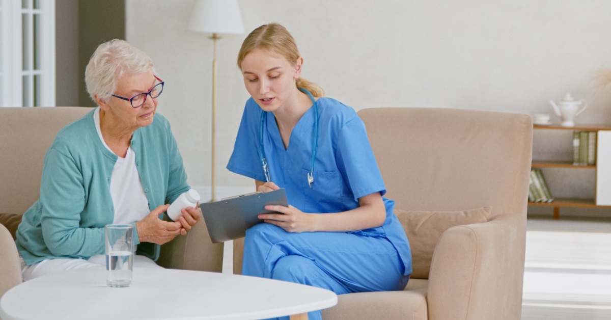 female doctor reading prescription to patient