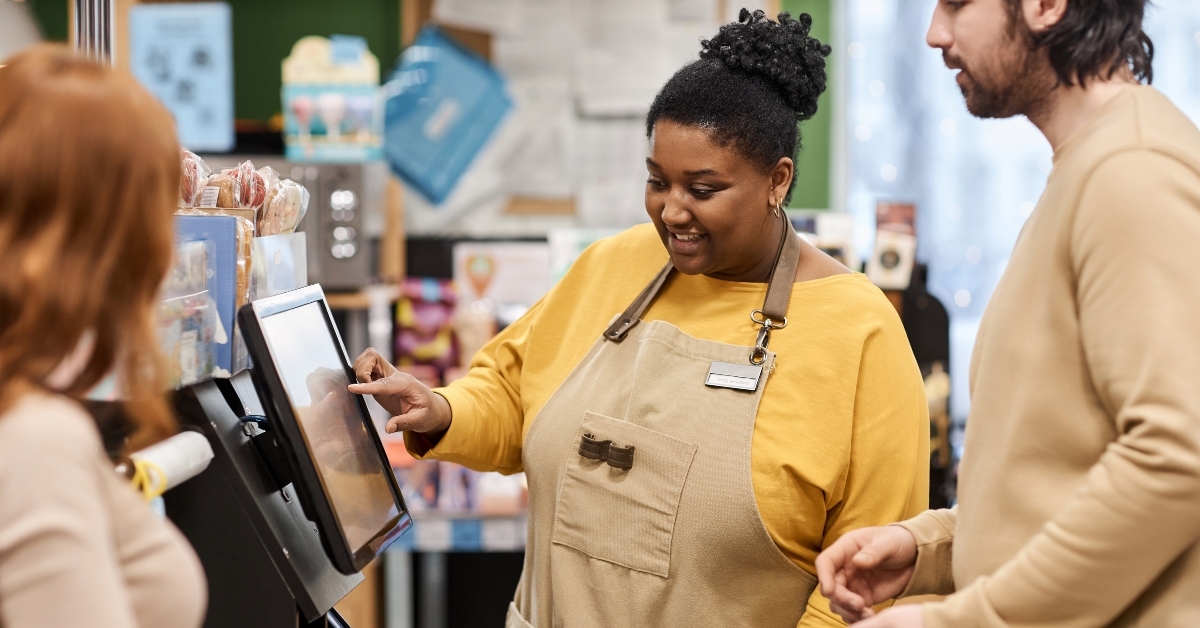 smiling black woman helping customers