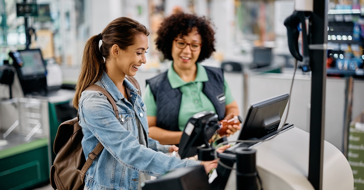 woman using self-service checkout
