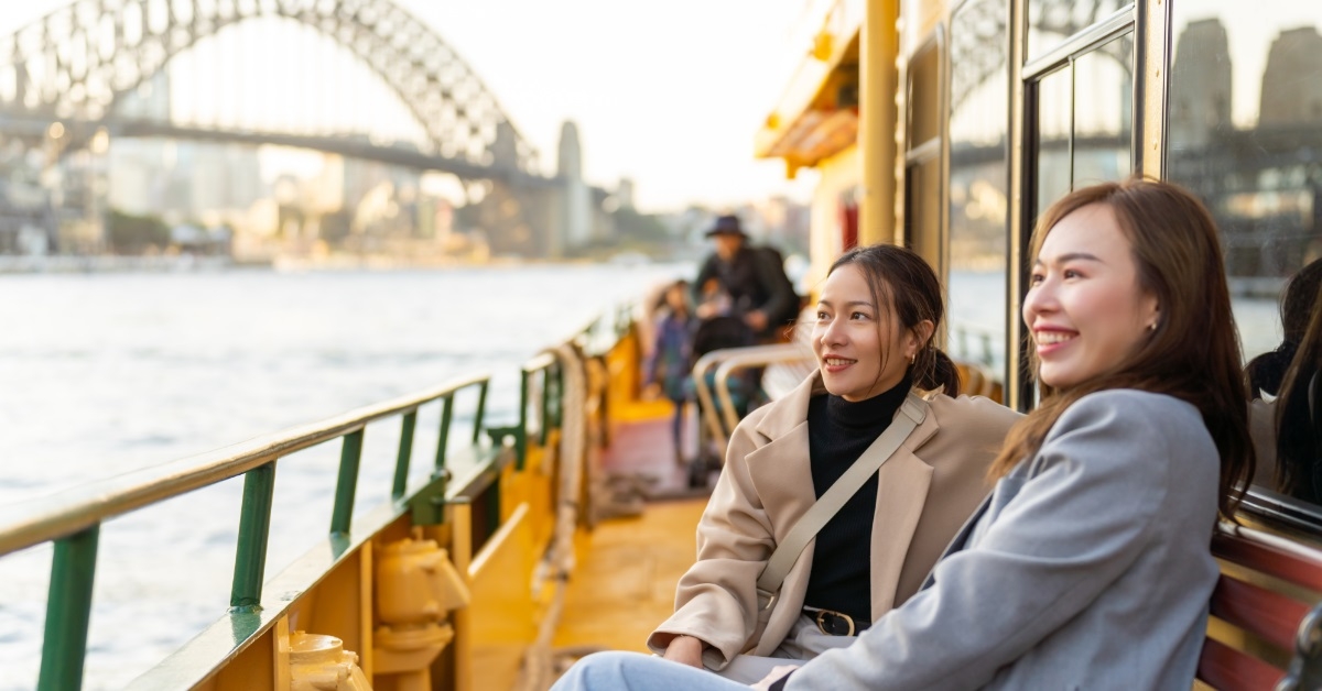women enjoying ferry ride in australia 