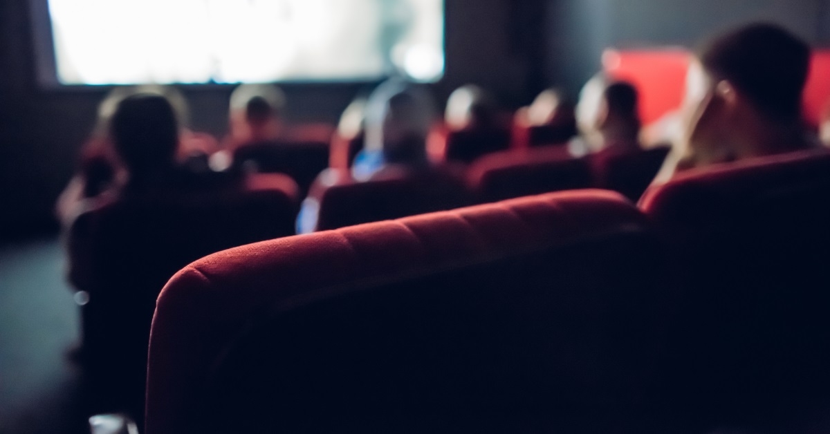 audience enjoying movie at cinema