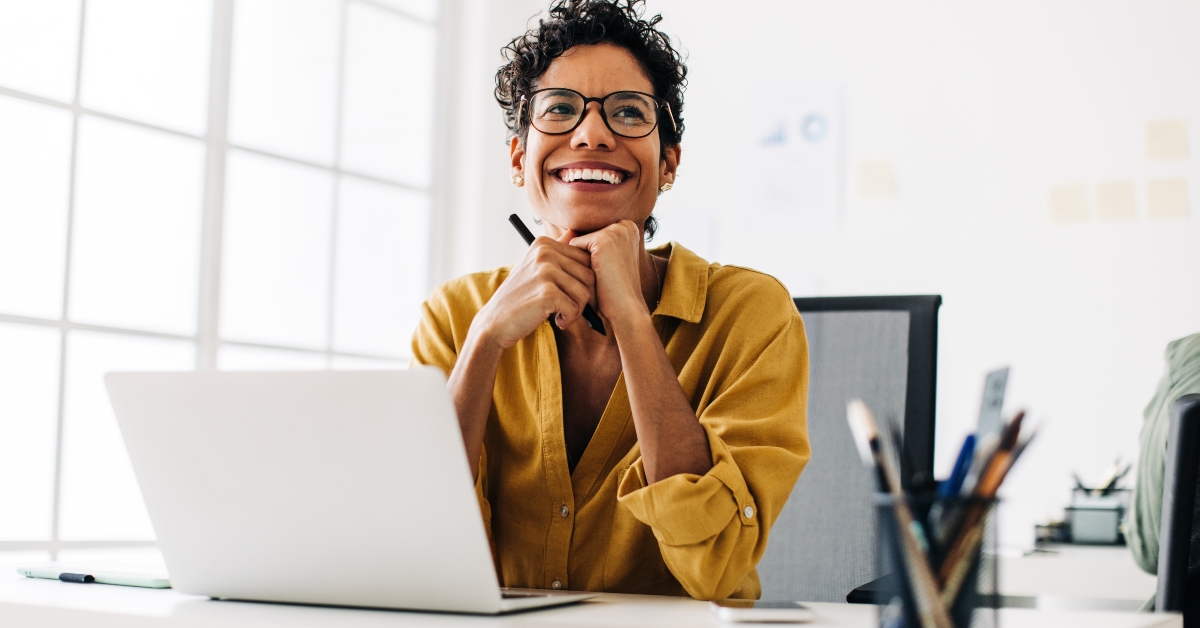 graphics designer sitting at her desk