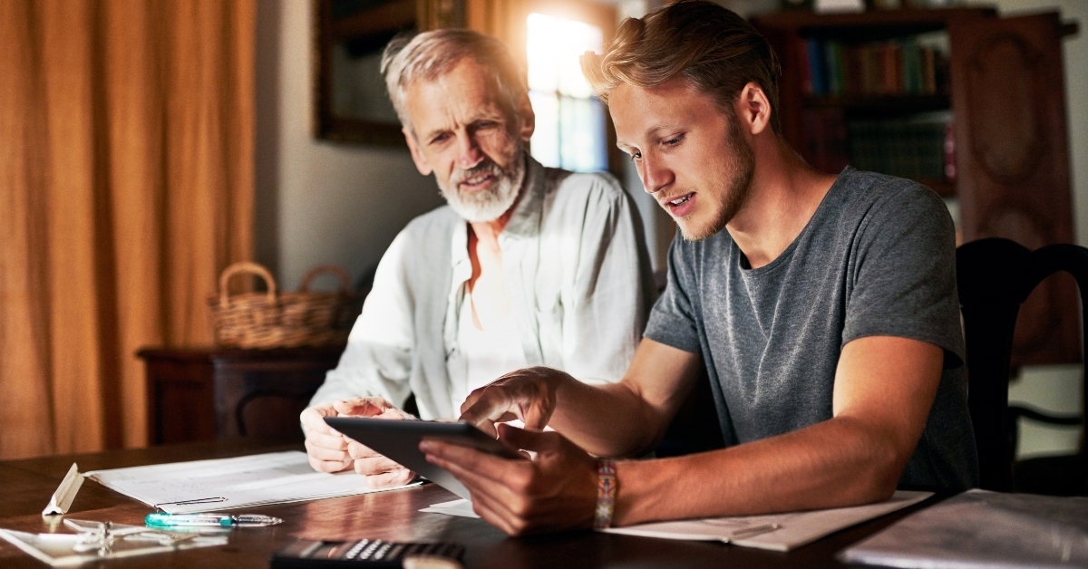 man helping his senior pensioner