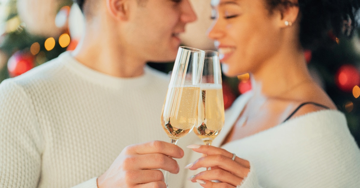 romantic couple toasting champagne glasses