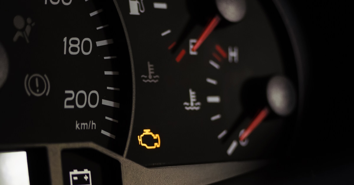 lit engine light on car dashboard