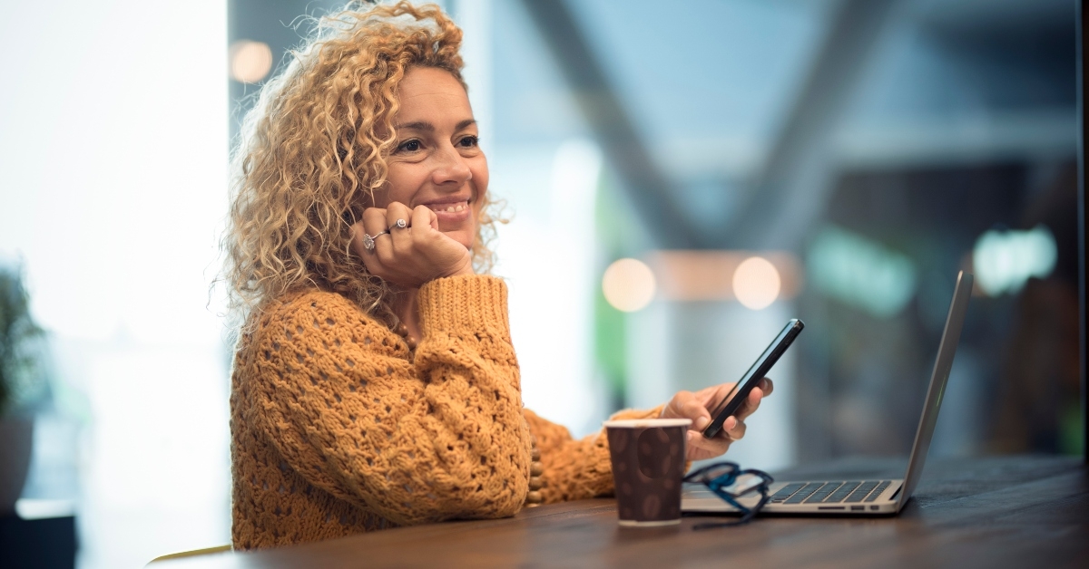 cheerful woman using phone