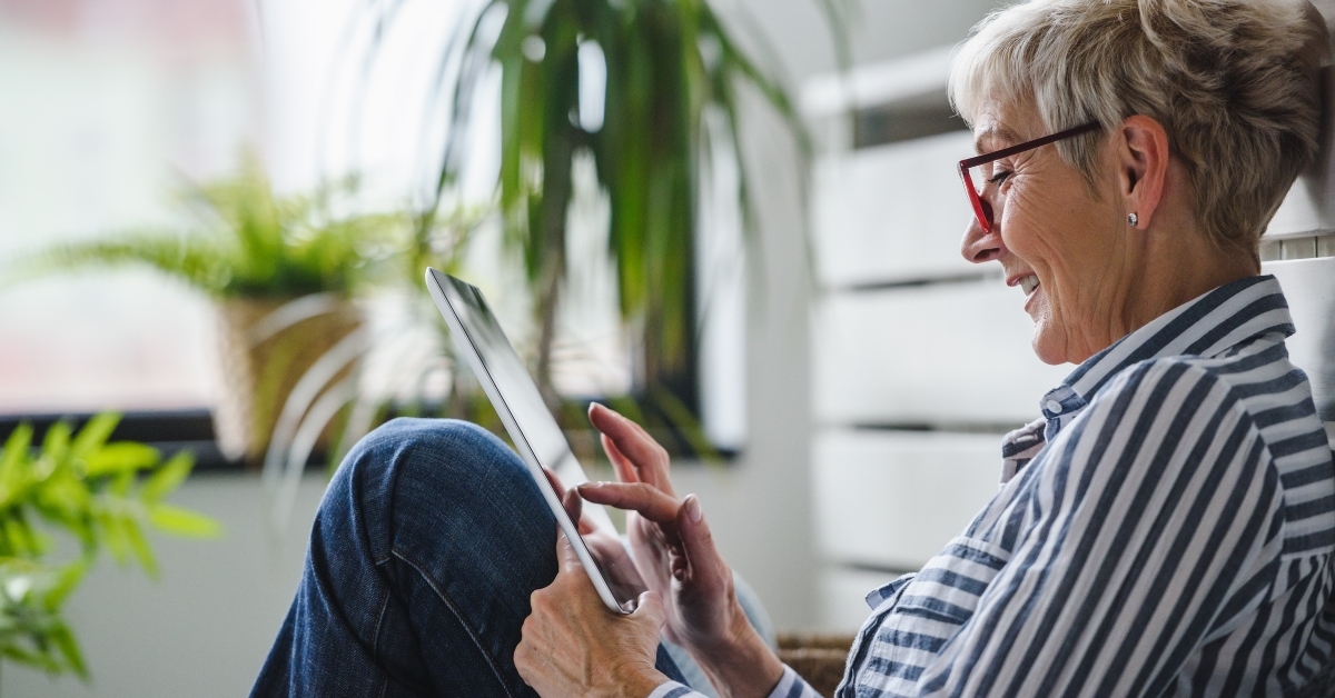 senior woman using digital tablet