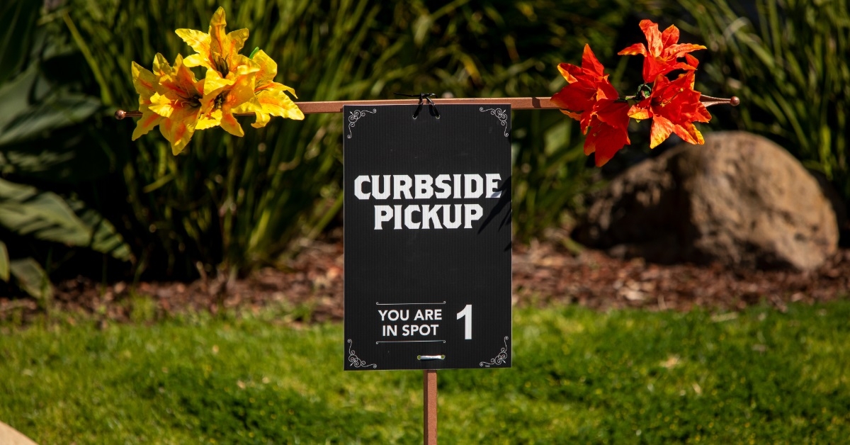 curbside sign board at outdoor restaurant