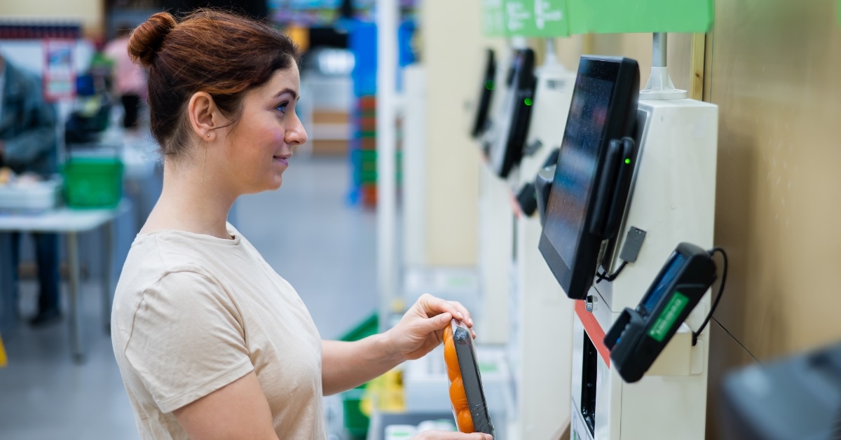 woman using self-checkout counter
