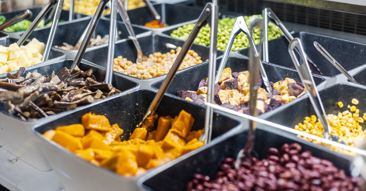 salad bar with forks in supermarket