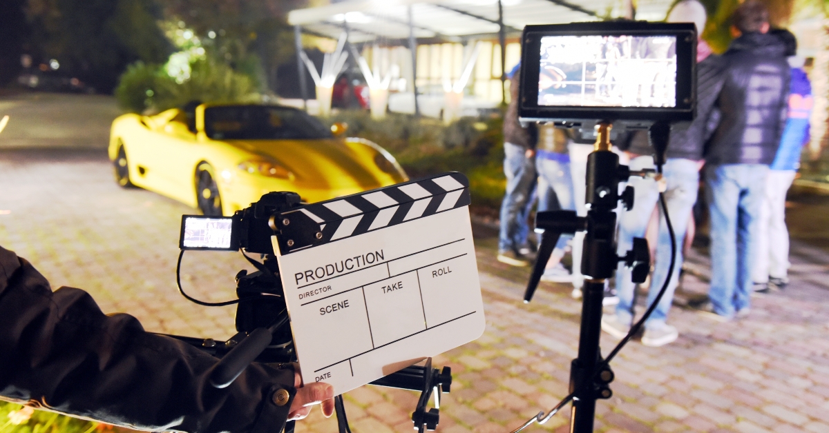 holding clapperboard during the production