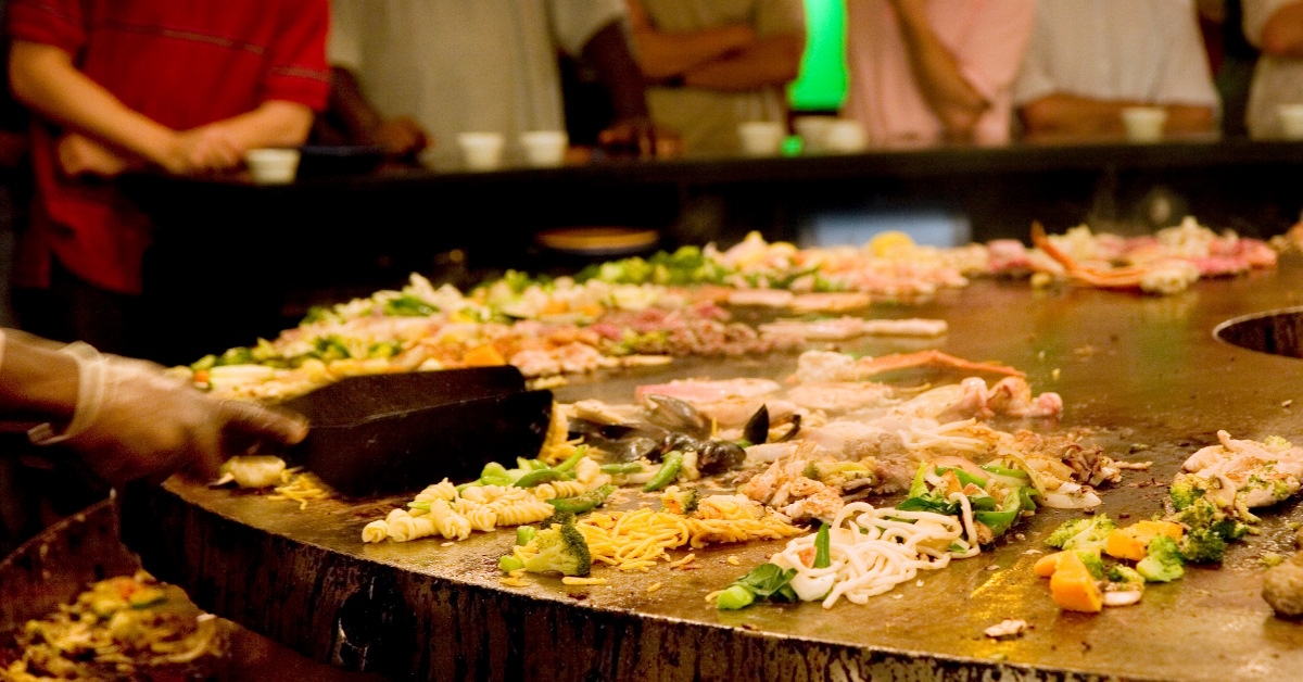 food getting prepared on mongolian grill