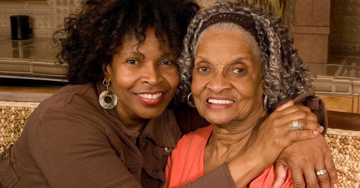senior woman hugging her daughter