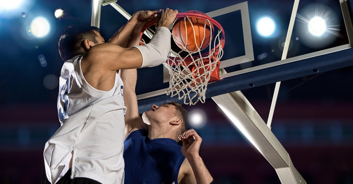 two basketball players in action