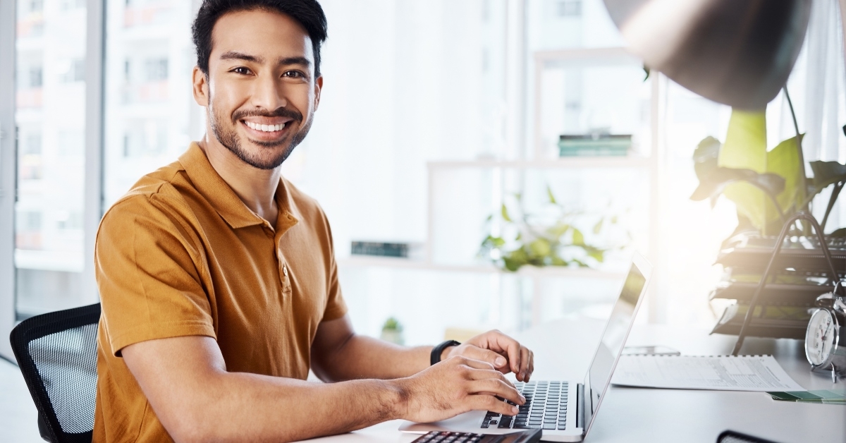 happy man typing accounting report