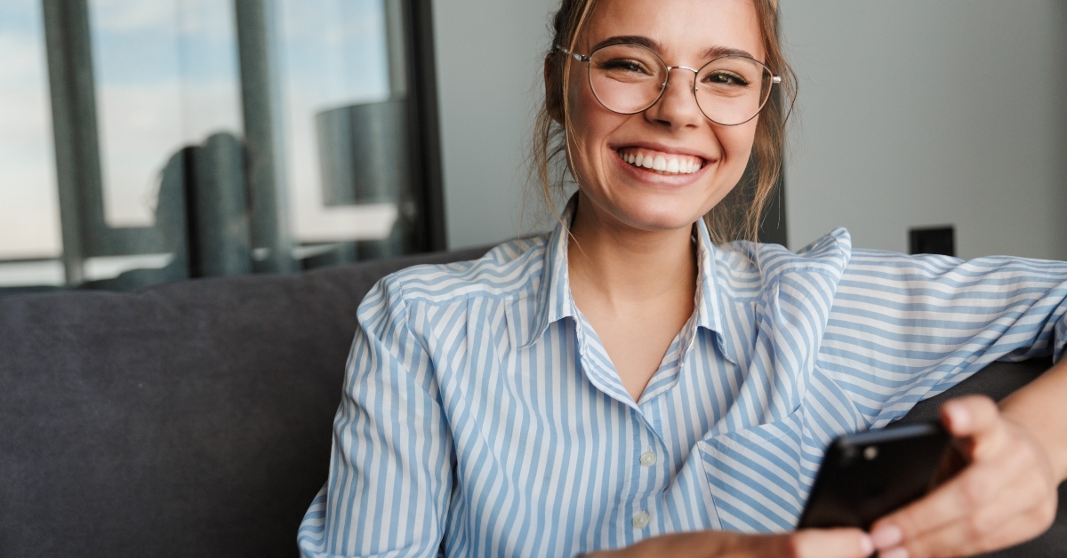 woman in eyeglasses smiling