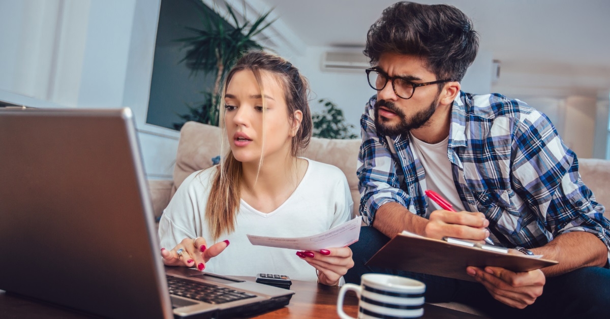 couple reviewing taxes together at home