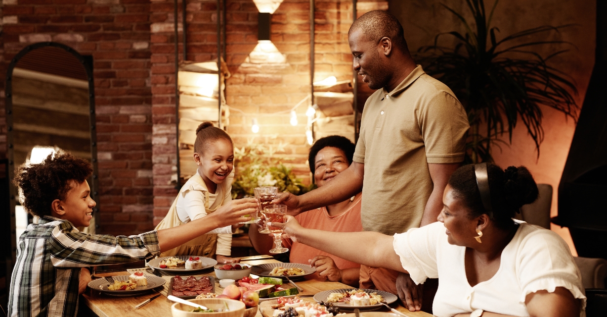 family clinking glasses and toasting