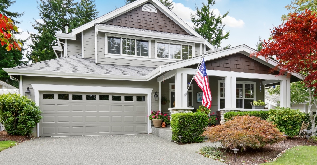 grey house with porch and garage