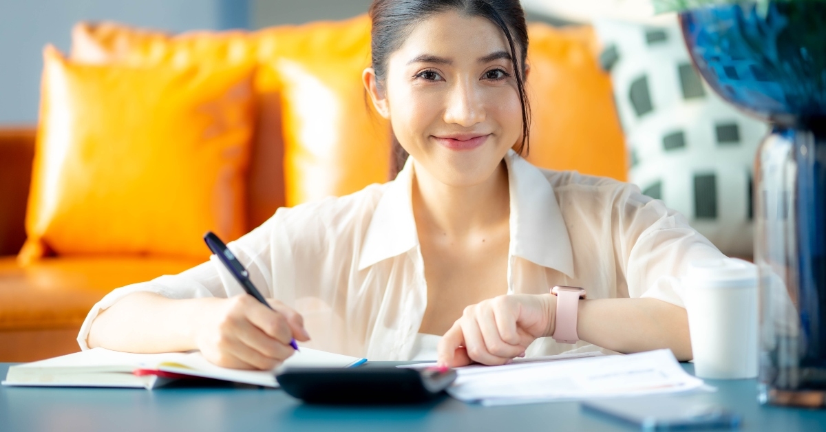 happy woman paying bill