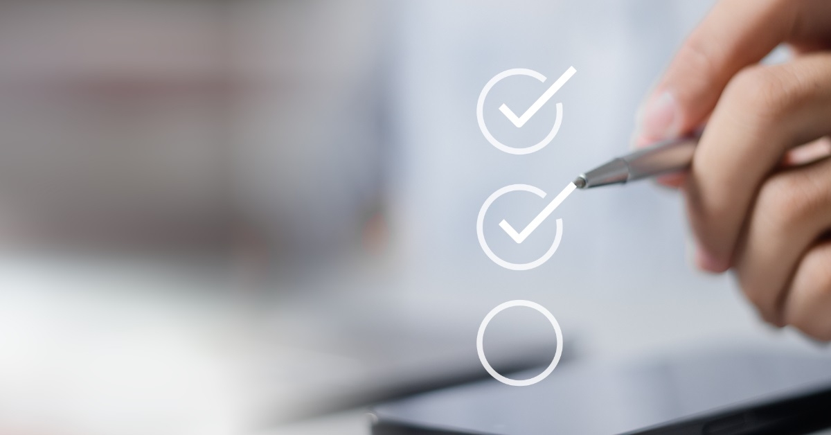 man checking virtual checklist with pen