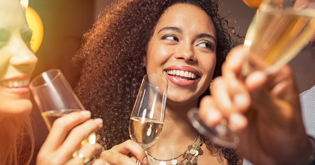 woman drinking champagne at party