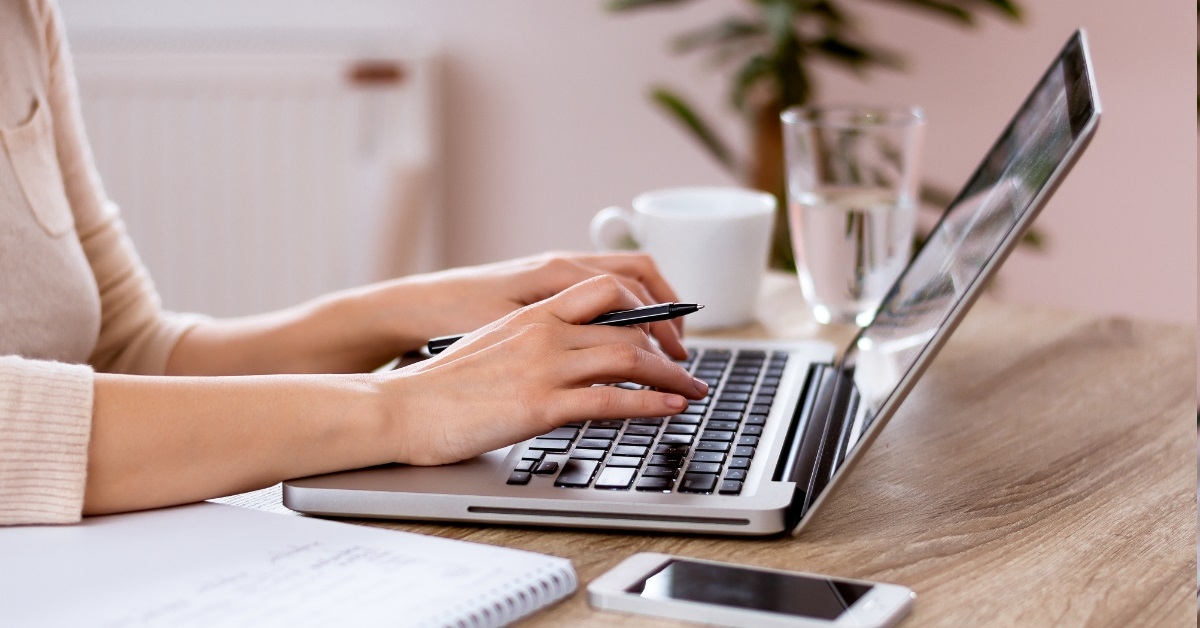 freelancer woman using laptop at home